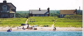 View of home from a boat out in the Bay waterfront-home-at-east-sandwich-beach_sanddollar